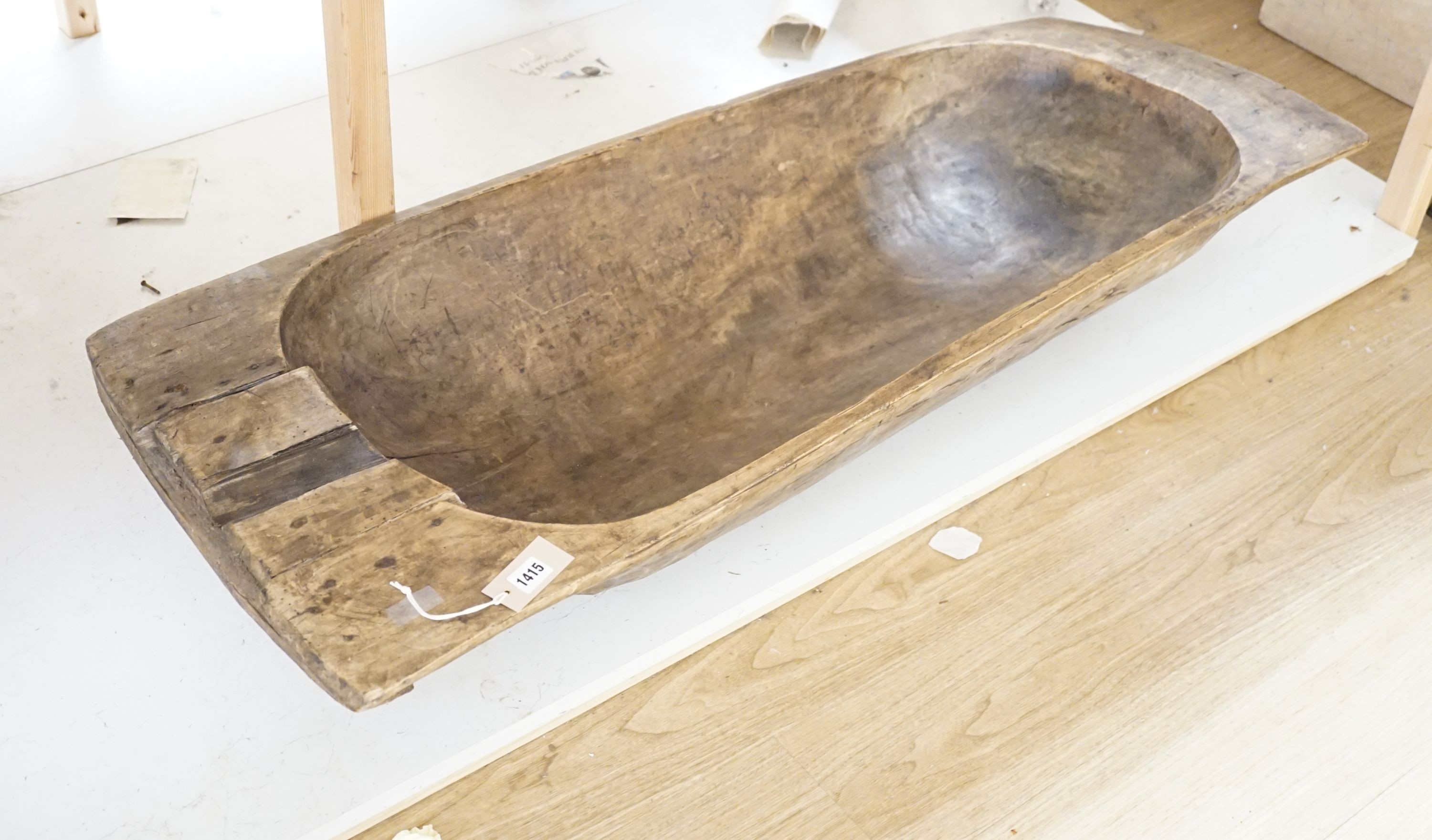 A large 19th century European fruitwood dough trough hewn from a single piece of wood. 132cm x 49cm. *This lot is being sold in aid of the charity Dogs Trust UK with 100% of the hammer price going to the charity